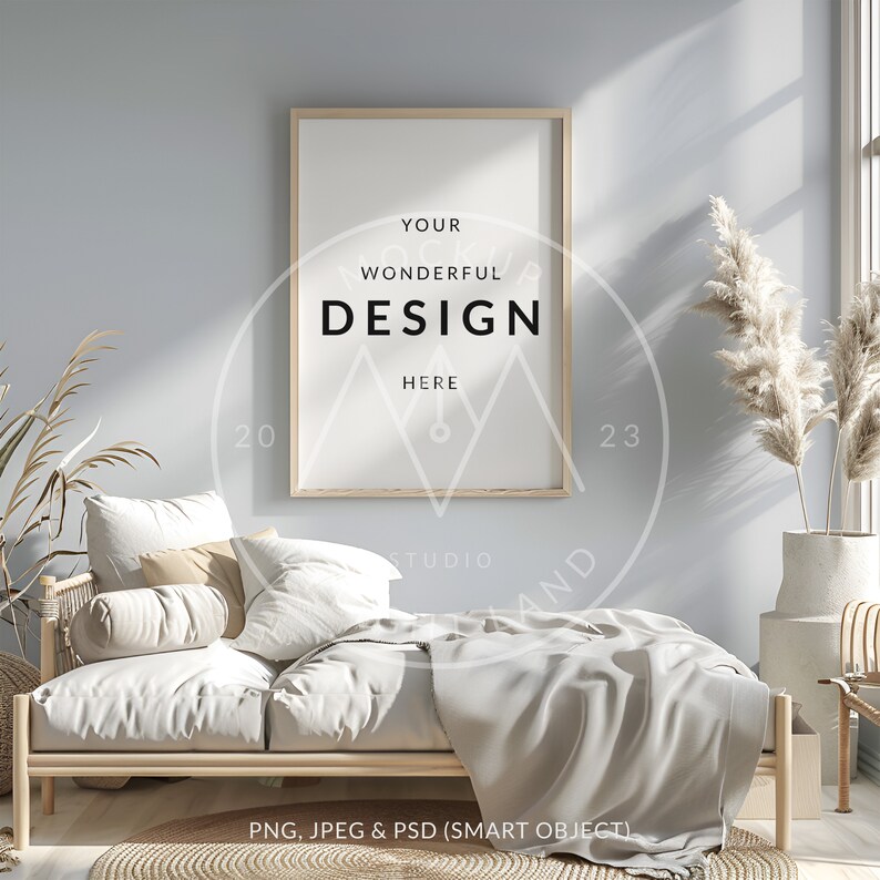 May include: A light wood frame with a white mat and a white background. The frame is hanging on a light blue wall. The text "YOUR WONDERFUL DESIGN HERE" is printed in black on the white background. The frame is in a living room setting with a couch, pillows, and a plant.