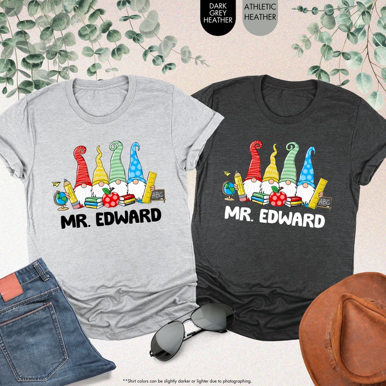 a couple of t - shirts sitting on top of a table