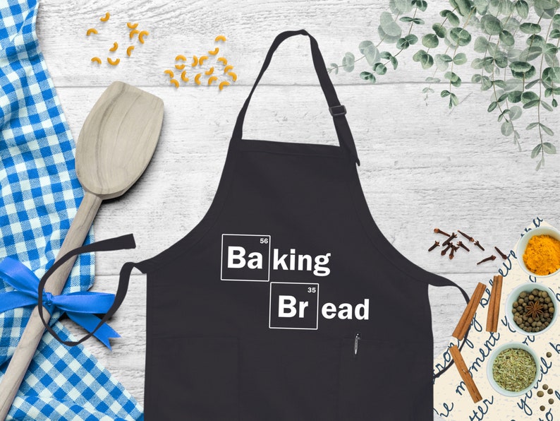 a black apron with the words baking and bread on it