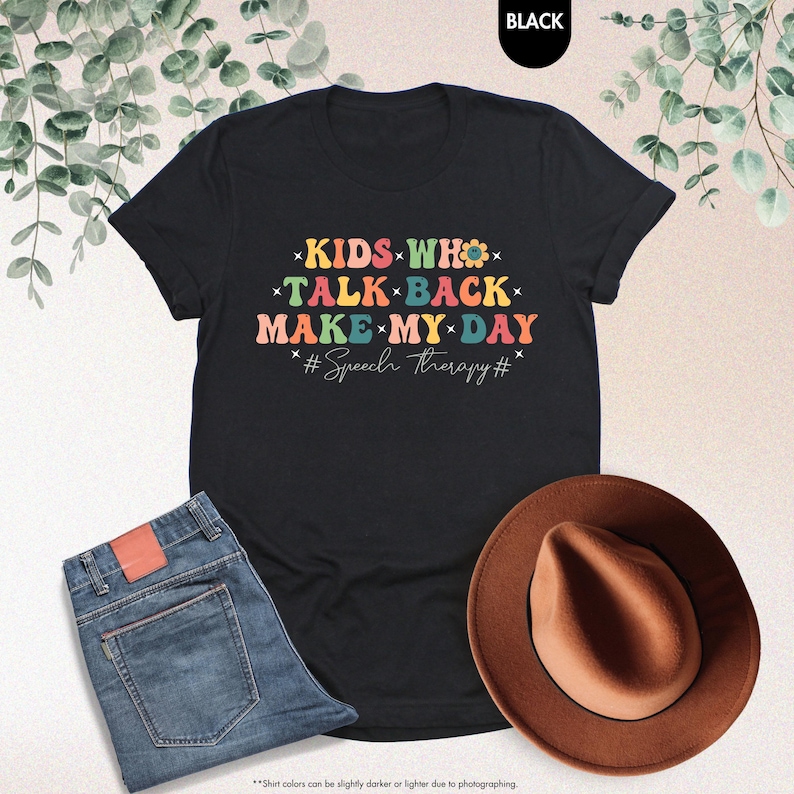 May include: Black t-shirt with a colorful retro design that says "Kids who talk back make my day #Speech therapy#"
