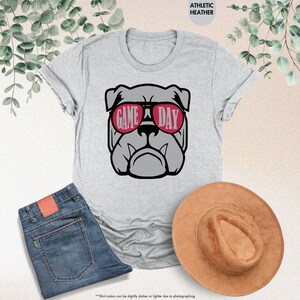 a t - shirt with a picture of a dog wearing sunglasses