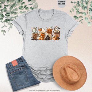 a t - shirt with a picture of a group of cats on it