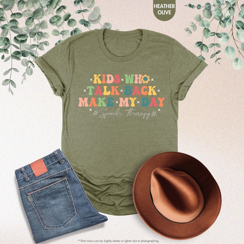 May include: A green t-shirt with the text "KIDS WHO TALK BACK MAKE MY DAY #Speech therapy#" in rainbow colors.
