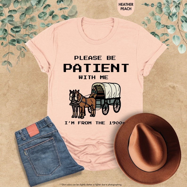 a t - shirt that says please be patient with me i'm from the