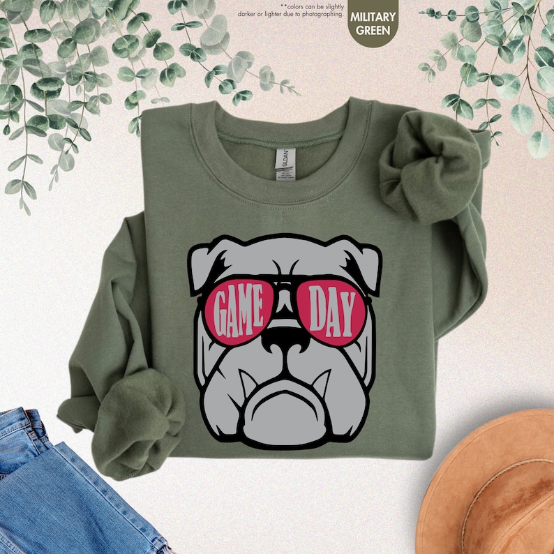 a green shirt with a bulldog wearing sunglasses