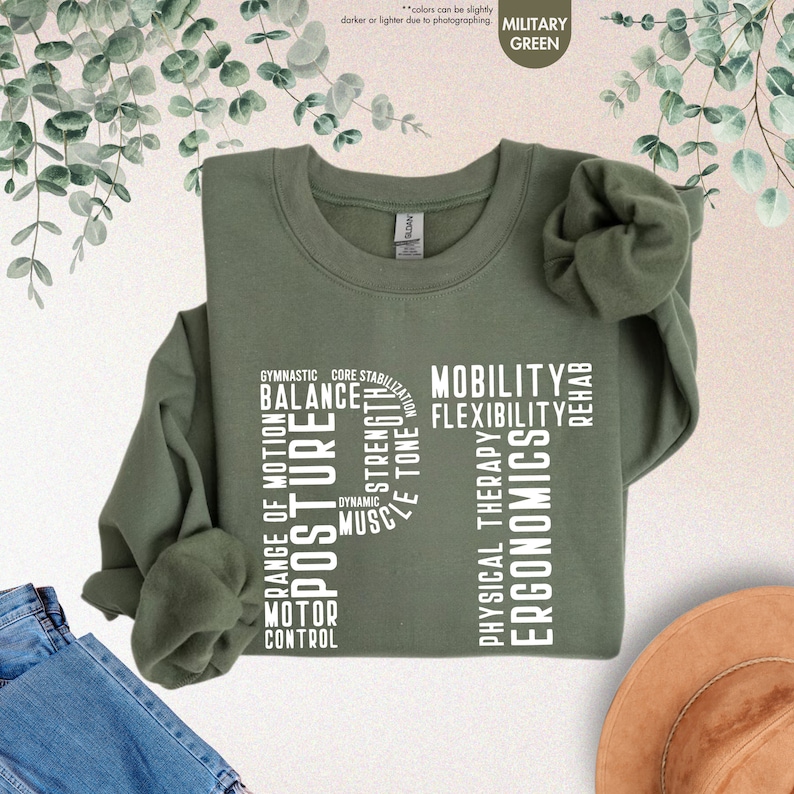 a green t - shirt with words on it and a hat next to it