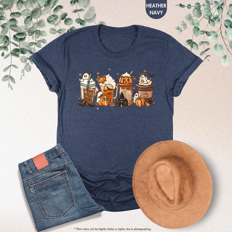 a t - shirt with a picture of three pumpkins on it