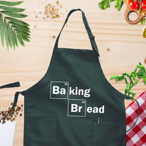 a green apron with the words baking and bread on it