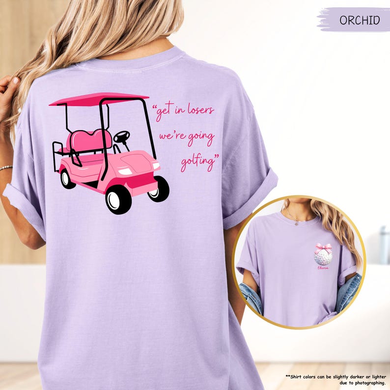 May include: Orchid-coloured t-shirt with a pink golf cart graphic and the text "get in losers we're going golfing." A smaller image on the right shows a golf ball with a bow.