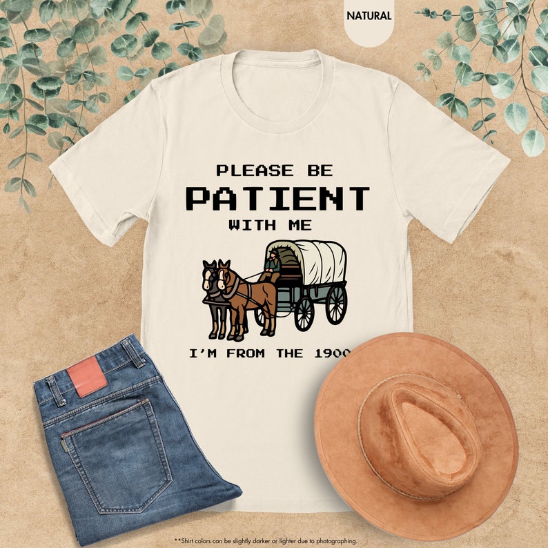 a t - shirt that says please be patient with me i'm from the