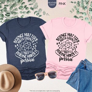three t - shirts and a hat on a table