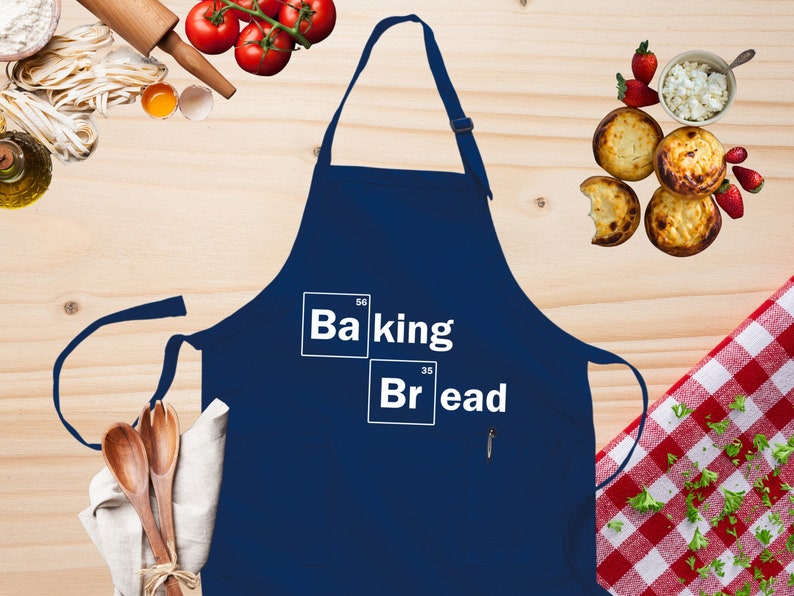 a blue apron with the words baking and bread on it