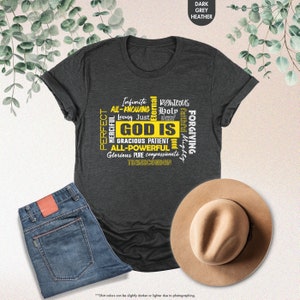 a t - shirt with the words god is on it next to a hat and