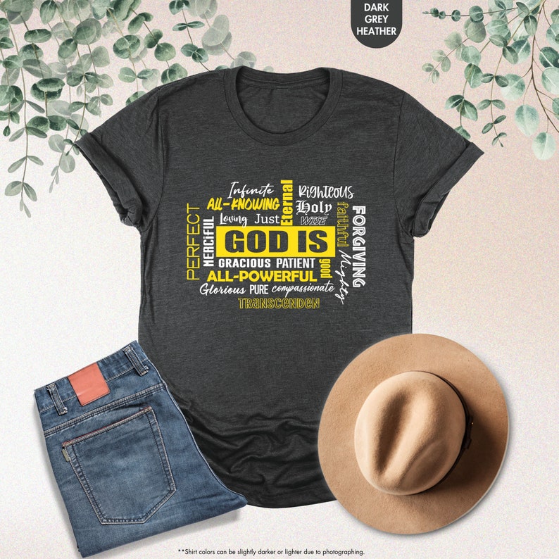 a t - shirt with the words god is on it next to a hat and