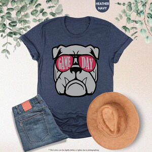 a t - shirt with a picture of a dog wearing sunglasses