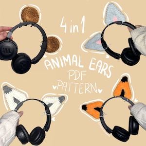May include: Four crochet animal ear patterns for headphones. The patterns include fox, cat, wolf, and bear ears. The text on the image reads "4 in 1 Animal Ears PDF Pattern".