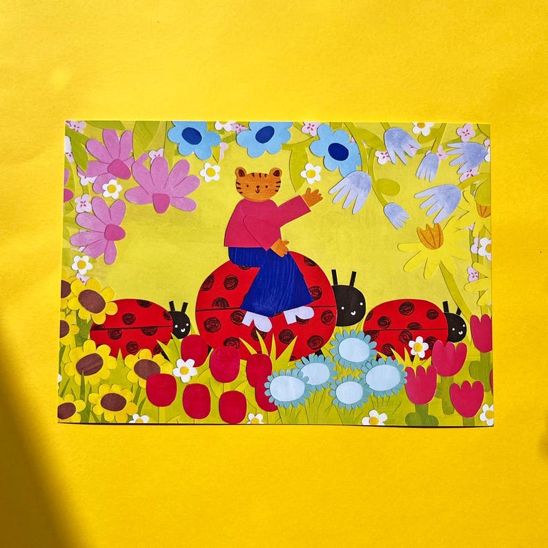 May include: A whimsical illustration featuring a tiger-like character riding a ladybug. The scene is filled with colorful flowers, including sunflowers, tulips, and daisies, set against a yellow background. Three ladybugs are present in the image.