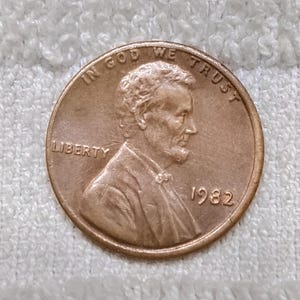 1982 Lincoln Cent Error-mynt • Sällsynt US Penny med fel på kanten (inget myntmärke)