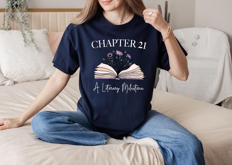 a woman sitting on a bed holding a book
