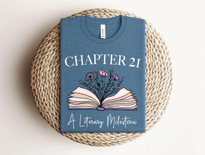 a t - shirt with a book and flowers on it