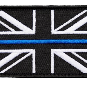 May include: Black and white embroidered Union Jack flag patch with a thin blue line across the centre.