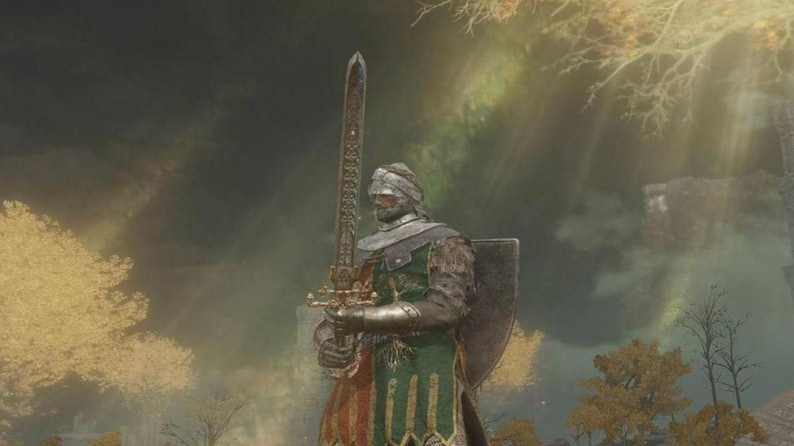 May include: A knight in a green and gold armor stands holding a large sword. The knight is wearing a helmet with a white cloth covering the face. The background is a blurry image of a forest with sunlight shining through the trees.