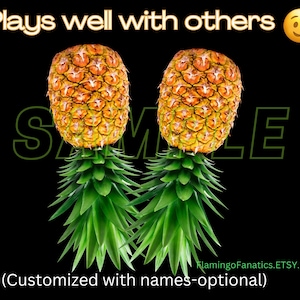 May include: Two pineapples with green tops and the text "Plays well with others" and a winking emoji. The text "SAMPLE" is partially visible in green letters. The text "(Customized with names-optional)" is at the bottom of the image.