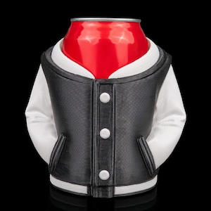 May include: A red soda can is dressed in a black and white varsity jacket. The jacket has white sleeves, a black body, white trim, and three white buttons. The background is black.
