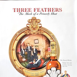 May include: A vintage advertisement for Three Feathers whisky. The ad features a bottle of whiskey with a gold label and a crest. The text on the label reads "Three Feathers Reserve" and "Established 1882". The ad also features a mirror reflecting a group of men in formal attire, with the text "Reflecting Good Taste since 1882". The ad copy reads "The Mark of a Princely Host" and "Born in the Elegant Eighties...still the mark of a Princely Host".