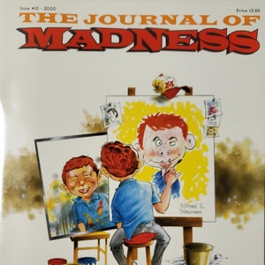 Puede incluir: La portada de la revista The Journal of Madness, con una ilustración de dibujos animados de un hombre pintando un autorretrato. El texto de la portada dice "The Journal of Madness" y "The Al Feldstein Interview".