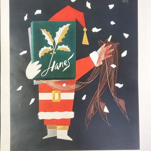 May include: Vintage Christmas advert showing a Santa Claus figure holding a green box with the word "Hanes" and a holly design. The Santa figure is in a red suit with white trim and a gold belt buckle, against a dark blue background with falling snow.