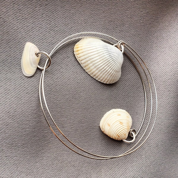 ocean lover bracelet handmade on memory wire wity personally collected  seashells from the Jacksonville Beach FL