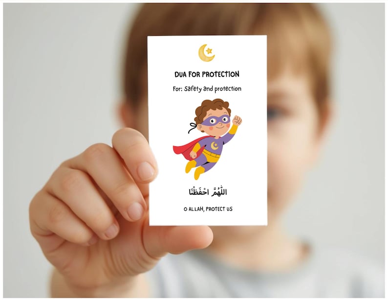May include: A white card held by a person features the text "DUA FOR PROTECTION" and "For: Safety and protection." A cartoon superhero with a red cape and purple mask is also on the card. The bottom of the card has Arabic text and the English translation "O ALLAH, PROTECT US."