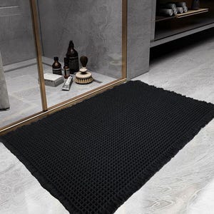 SHIMOH Wafel Badmat, Superabsorberende Antislip Badmat voor Badkamervloer, Machinewasbare Badkamermat met Kwastjes, Rubberen Achterkant Zwart