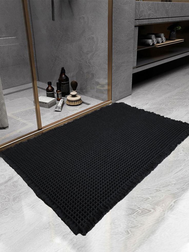 SHIMOH Wafel Badmat, Superabsorberende Antislip Badmat voor Badkamervloer, Machinewasbare Badkamermat met Kwastjes, Rubberen Achterkant Zwart