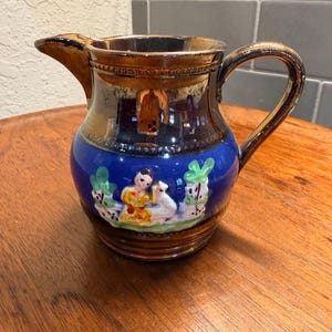 Allerton Longton Pottery England Luster Copper tone Relif Scene 3 3/4"h Creamer