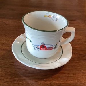 Pfaltzgraff Snow Village cup and saucer set