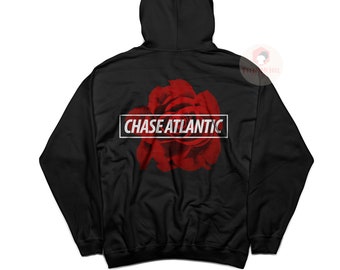 May include: Black hooded sweatshirt with a red rose graphic and the text "CHASE ATLANTIC" in white.