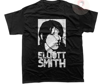 May include: Black t-shirt with a white distressed graphic of Elliott Smith's face and name.