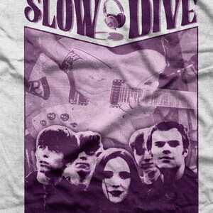 May include: A purple and white graphic t-shirt featuring the band Slowdive with a guitar and headphones. The band members are pictured in a vintage style.