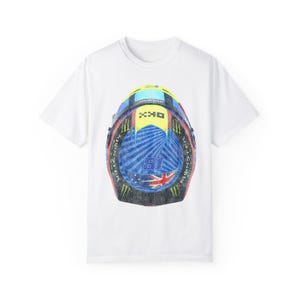 May include: White t-shirt with a graphic print of a blue, yellow, red, and green motorcycle helmet. The helmet has a white and blue Australian flag on the side.