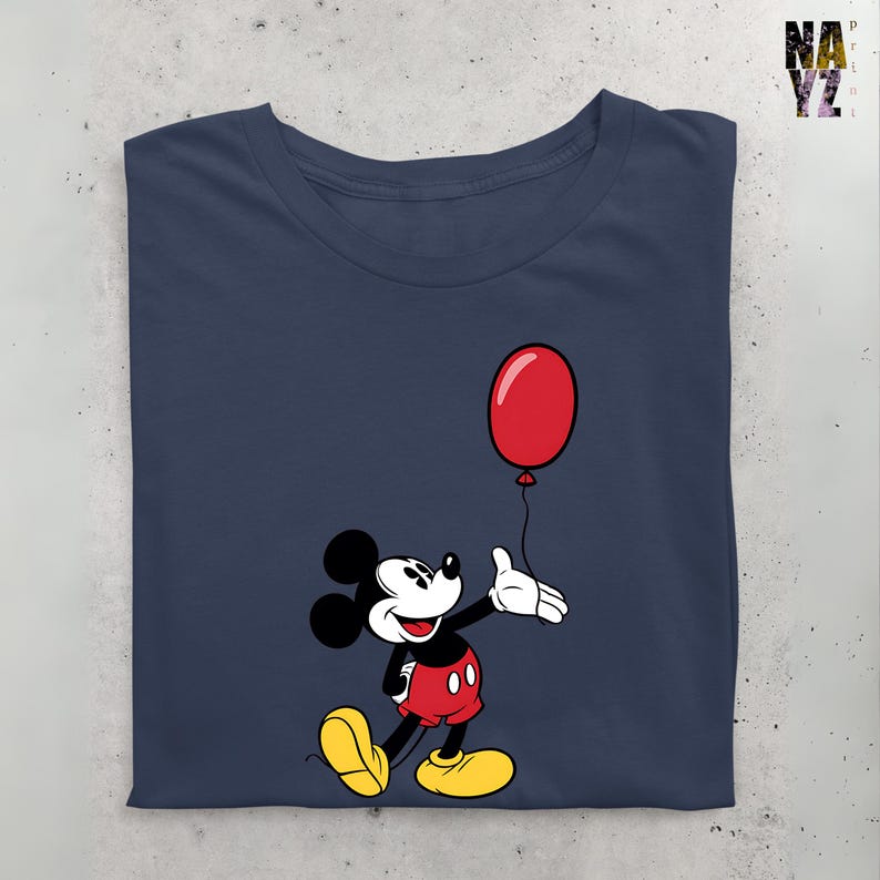 May include: A navy blue t-shirt with a cartoon image of Mickey Mouse holding a red balloon. Mickey Mouse is wearing red shorts and yellow shoes.