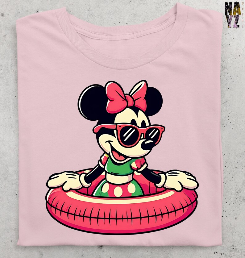 May include: Pink t-shirt with a cartoon character wearing sunglasses and a bow, floating in a red inner tube. The character is wearing a green and red polka dot dress. The shirt is folded.