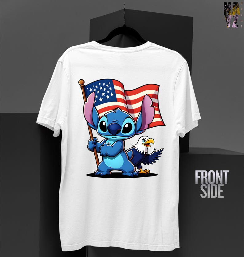 May include: White t-shirt featuring a cartoon character holding an American flag, with an eagle on the right. The character is blue with large ears. The flag has red and white stripes and a blue field with white stars. The words "FRONT SIDE" are printed on the right.