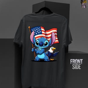 May include: Dark gray t-shirt featuring a cartoon Stitch character holding an American flag, with an eagle beside him. The flag has red and white stripes and blue stars. The words "FRONT SIDE" are printed on the right side.