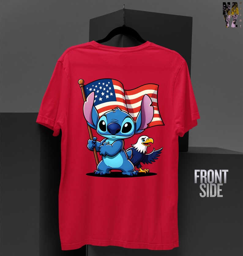 May include: Red t-shirt featuring a cartoon character holding an American flag with an eagle. The character is blue with large ears. The flag has red and white stripes and a blue field with white stars. The shirt has the words "FRONT SIDE" on the side.