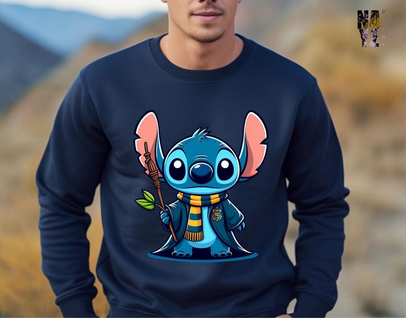 May include: A navy blue sweatshirt with a cartoon image of Stitch from Lilo & Stitch dressed as a wizard. Stitch is holding a wand and wearing a yellow and blue scarf.
