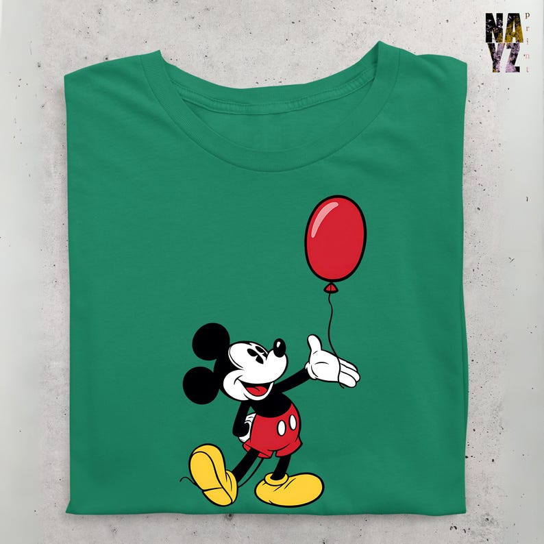 May include: A green t-shirt with a cartoon image of Mickey Mouse holding a red balloon. Mickey Mouse is wearing red shorts with black buttons and yellow shoes.