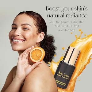 May include: A woman smiles, holding a sliced orange. The image promotes a skincare product, featuring a black bottle with gold accents labeled "Skin Centrick Powerful VC Glow Serum." Text reads "Boost your skin's natural radiance."