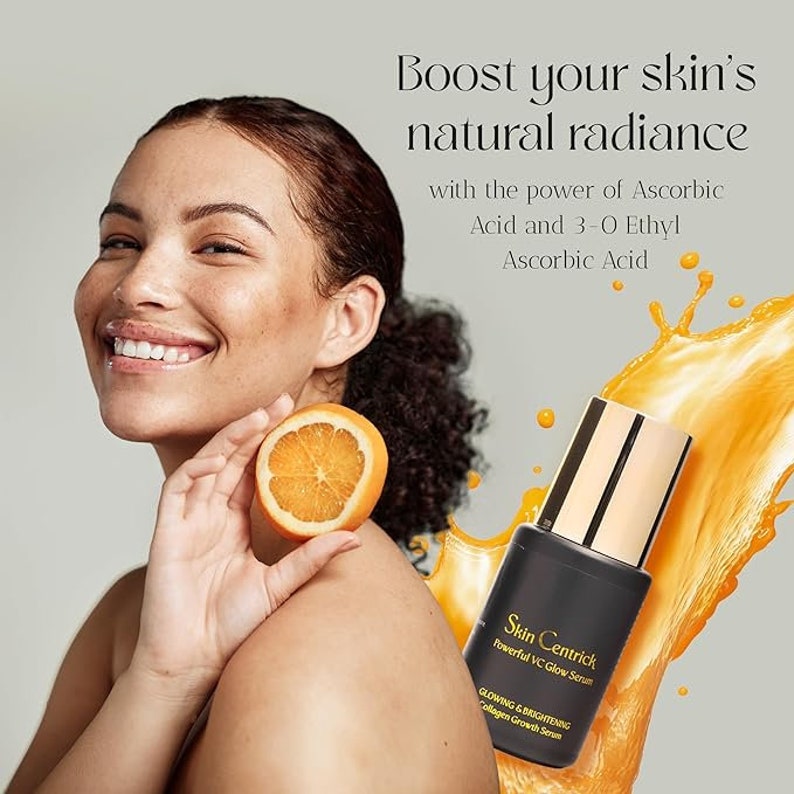May include: A woman smiles, holding a sliced orange. The image promotes a skincare product, featuring a black bottle with gold accents labeled "Skin Centrick Powerful VC Glow Serum." Text reads "Boost your skin's natural radiance."